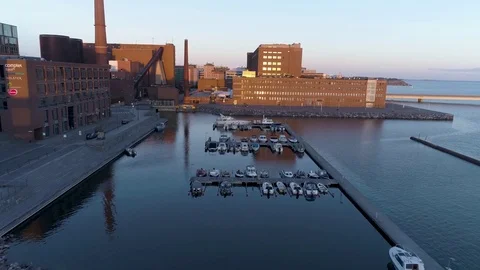Aerial cool blue view drone flying forward above marina with boats during sunset Stock Footage 78777659