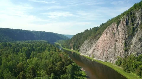 Aerial: Copter flight forward above the forest and river in canyon Stock Footage 114722553