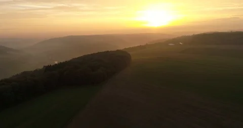 Aerial copter flight over the charming misty fields, mountains and forests Stock Footage 87522201