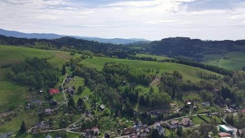 Aerial countryside landscape with patchwork fields, winding road, scattered.. Stock Photos