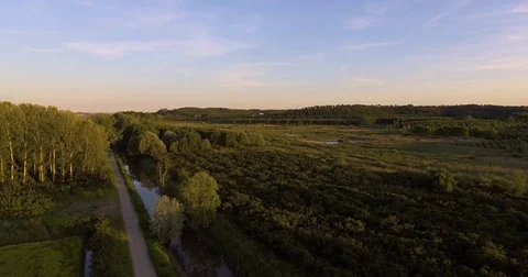 Aerial countryside landscape on sunset with marshy fields, small river a Video stock 75977341