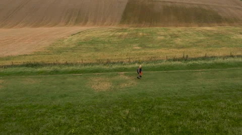 Aerial - Couple walking in field Stock Footage 59407548