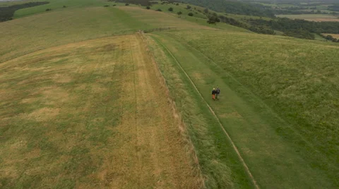 Aerial - Couple walking in field Stock Footage 59407828