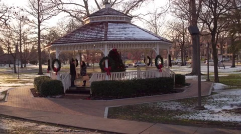 Aerial of couple walking through park at Christmas Stock Footage 59169303