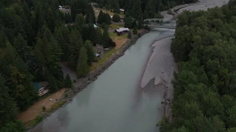 Aerial of Cowlitz river flowing through forested valley in Packwood Washington Stock Footage 339356704