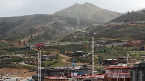 Aerial of crane construction at ski resort Deer Valley in Utah with clouds 動画素材 335785192