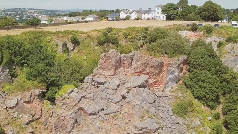 Aerial crane down. Beautiful cliffside, overseeing small town. Stock Footage 96036887