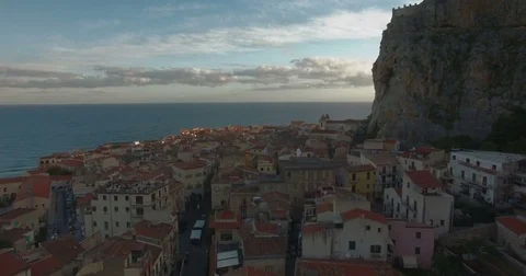 Aerial Crane down in Cefalu during sunrise Stock Footage 76979803