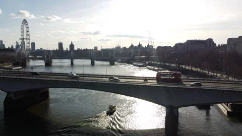 Aerial Crane Down by  Waterloo Bridge as Police Boat  Passes Under Stock Footage 150299679