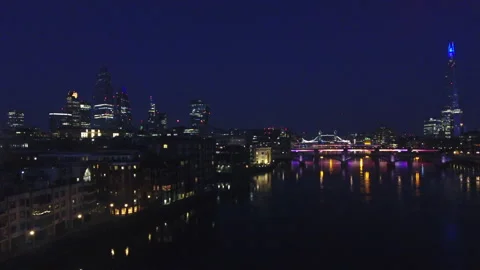 Aerial Crane Up with Dramatic View of City Skyline and River Thames at Night Stock Footage 150424551