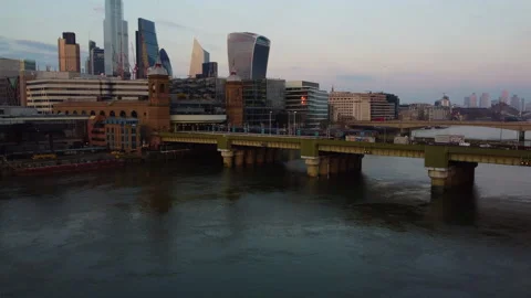 Aerial Crane up as Train Pulls out from Cannon Street Bridge Stock Footage 150265346