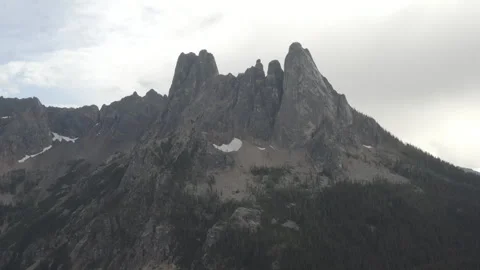 Aerial cranes up while looking at the Liberty Bell Mountain in North Cascades Stock Footage 345176199