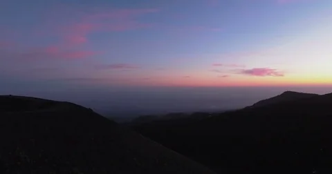 Aerial craning down on Mount Etna during dusk Stock Footage 77098960