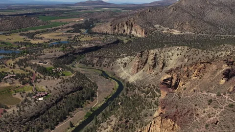 Aerial of Crooked River and Monkey Face Rock Spire at Smith Rock State Park Stock Footage 335922924