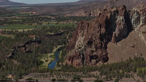 Aerial of Crooked River through Smith Rock State Park in spring in Oregon 動画素材 335892519