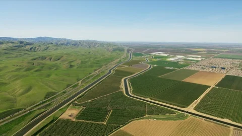 Aerial crops patchwork fields natural rolling hills California Stock Footage 91545985