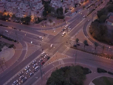 Aerial: Crossroad with traffic in the evening - 360 Spin shot Stock Footage