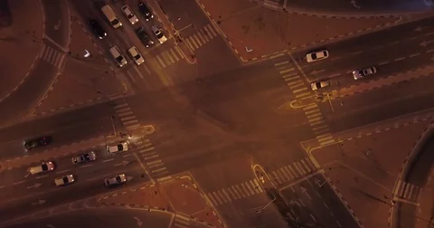 Aerial: Crossroad with traffic in the evening - Top shot Stock Footage