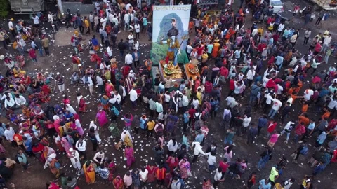 Aerial of the crowd of Hindu devotees dancing and celebrating the holy Stock Footage 254391548