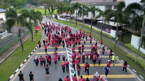 Aerial crowd jogging at road Stock Footage 318092759
