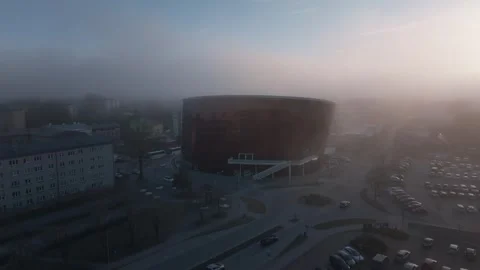 Aerial cultural hall with rounded facade and misty town square Stock Footage 337264456