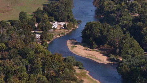Aerial of Current River winding through forest in Van Buren Missouri Stock Footage 344753043