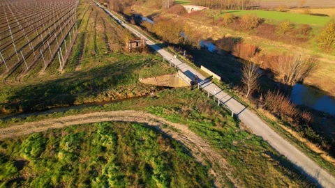 Aerial Dad&amp;Son drone flight over view apples trees path field in Tuscany 4k  Stock Footage 234130719