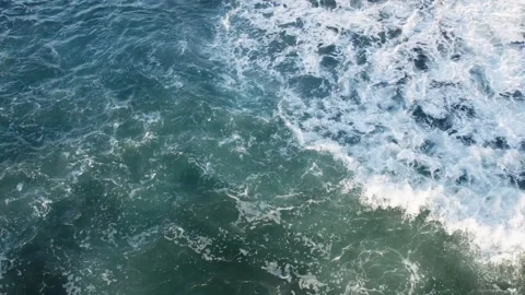 Aerial Dance of Waves: Bali's Oceanic Majesty during Low Tide – 4K Drone Video stock 247486110
