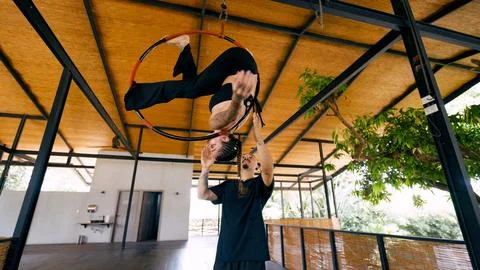 Aerial dancer practicing lyra hoop with instructor in costa rica studio Stock Photos