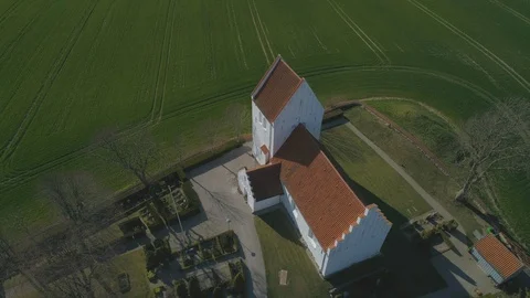 Aerial of Danish medieval Christian church Spring Stock Footage