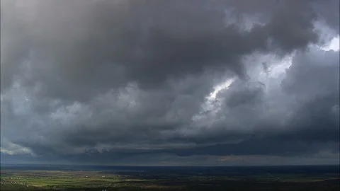 Aerial of dark clouds over the green landscape, Passing Storm Over Lake Ontario Stock Footage 109138085