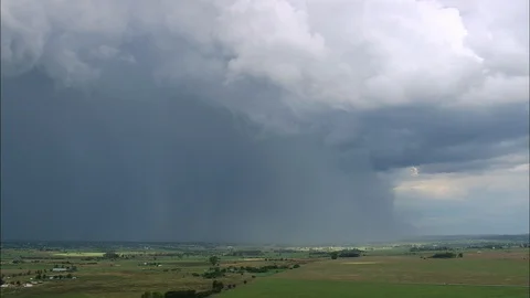 Aerial of dark clouds over the green landscape, Lightning Over The Veldt Stock Footage 109444426