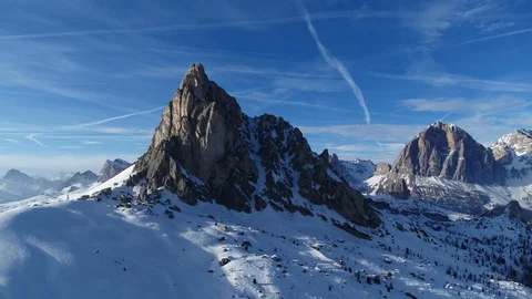 Aerial from dark to light, shadow side of the mountain to the bright side. Stock Footage 126824560