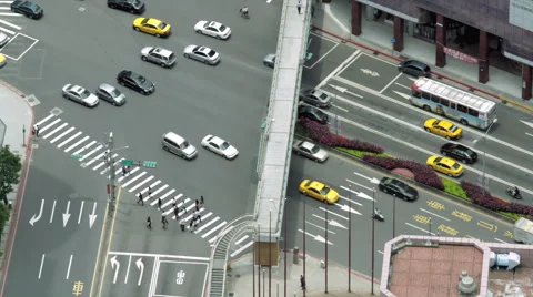 Aerial daytime time-lapse looking down at a busy street junction in Taipei Stock Footage 57102829