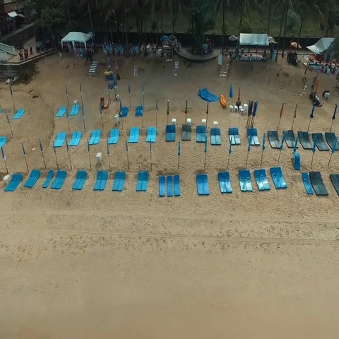 Aerial: Deck chairs on the beach. Stock Footage 69570688