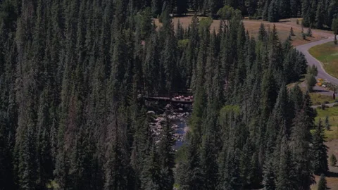Aerial of deck over river on Wolf Creek Pass in Pagosa Springs Colorado Stock Footage 342747448