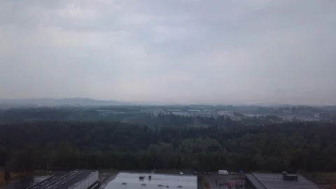 Aerial, decreasing, drone shot, down towards factories, on a norwegian Video stock 103066000