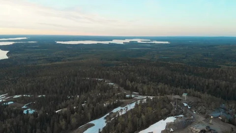 Aerial, decreasing, drone shot, down on the Vuokatinvaara hills, a lake, Video stock 108684891