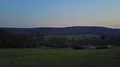 Aerial deep flight start evening meadow lake valley landscape before spring 4k 4k or 4k+ Resolution