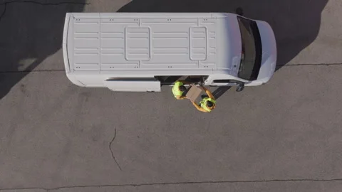 Aerial - Delivery men unloading some parcels form the delivery van  Stock Footage 263897615