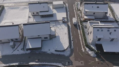 Aerial - Delivery van driving trough the housing community delivering parcels Stock Footage 263897366