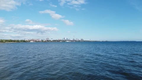 Aerial descending in altitude while looking at Toronto skyline from over Humber  Stock Footage 151975541