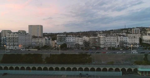 Aerial descending view of the seafront in Brighton at sunset Stock Footage 80987684