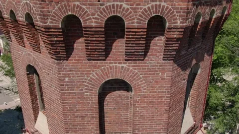Aerial descent along facade of old fire tower Stockbeeldmateriaal 333497161