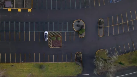 Aerial Descent Over Empty Umpqua Community College’s Blacktop Parking Lot Stock Footage 302011063