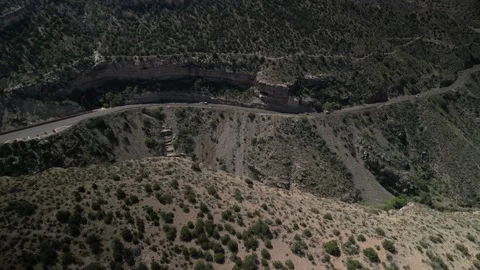 Aerial desert cliffs and state highway 82 in High Rolls New Mexico Stock Footage 332141485
