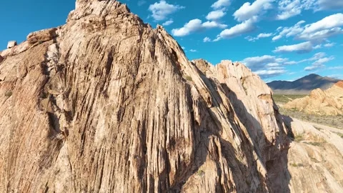Aerial Desert Sandstone Cliffs Dramatic Fly Through with Blue Sky and Rugged Stock Footage 315811371