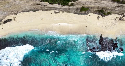Aerial of Diamond Beach with Waves and Limestone Cliffs, Nusa Penida Bali Stock Footage 331212316