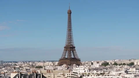 Aerial dimension of the eiffel tower with blue sunny sky in Paris Stock Footage 252096966