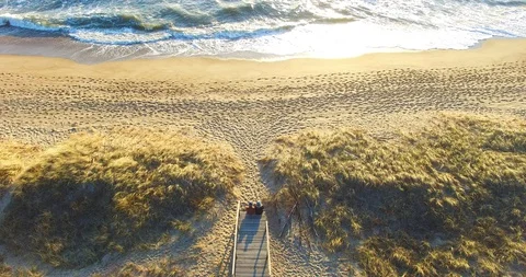 Aerial dinamic view from a top that starts from a couple sitting - 004 Stock Footage 128576992